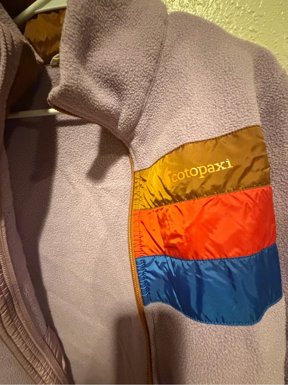cotopaxi Lavender women’s Fleece Jacket with Gold, Orange & Blue Pocket